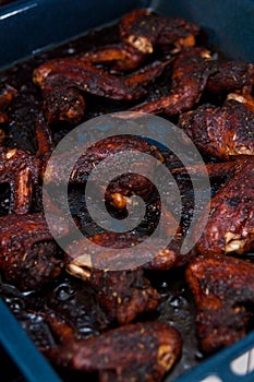 Chicken wings baked in dark soy sauce