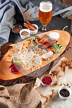 Chicken wings, cheese and breaded fish served with cold beer