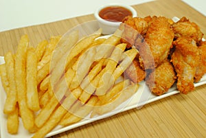 Chicken wings with fries and dipping sauce
