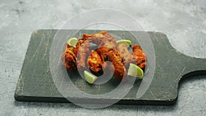 Chicken wings with lime slices