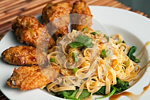 Chicken Wings with Noodles and Spinach