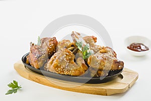 Chicken wings with sesame on white background