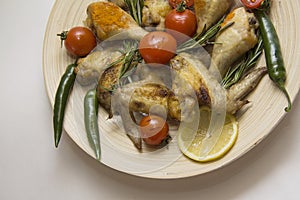 Chicken wings with tomato,chili and rosemary