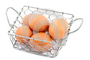 Chicken wire basket filled with eggs