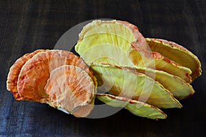 Chicken-of-the-wood mushroom on wooden background