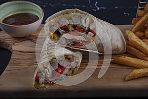 Chicken Wrap. Chicken fajita tortilla wrap sandwich. Tasty wraps with grilled chicken meat and fresh parsley