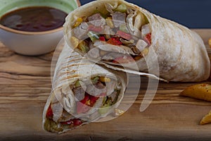 Chicken Wrap. Chicken fajita tortilla wrap sandwich. Tasty wraps with grilled chicken meat and fresh parsley