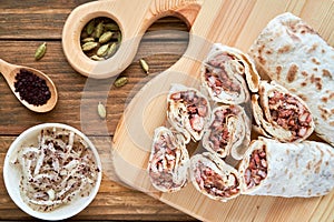 Chicken wrap roll shawerma. Traditional arabic roll with chicken msahhen