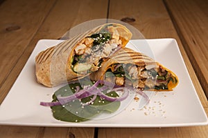 Chicken wrap on a wooden table