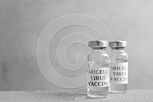 Chickenpox vaccine on table, space for text. Varicella virus prevention