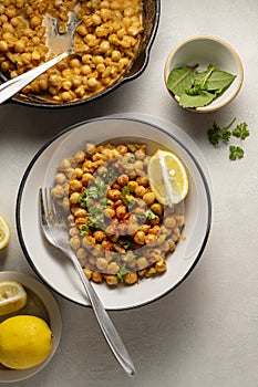 Chickpea dish with curry, cooked chickpeas with spices and herbs. Vegetarian food meal