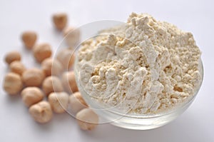 Chickpea flour and chickpeas on white. Alternative gluten-free flour for baking and cooking