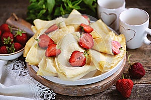 Chickpea flour pancakes with fresh strawberries