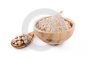 Chickpea flour in wooden bowl isolated photo