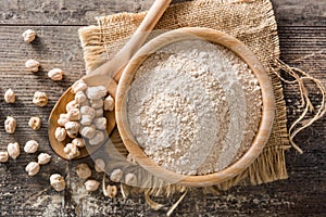 Chickpea flour on wooden table