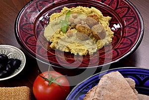 Chickpea hummus with falafel close-up stock images