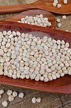 Chickpea portion on red wood platter