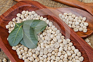 Chickpea portion on red wood platter