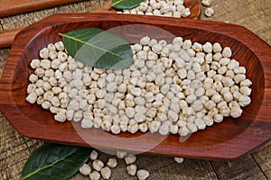 Chickpea portion on red wood platter