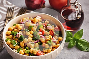 Chickpea salad with green pepper, red onion and vinaigrette dressing.