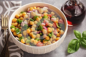 Chickpea salad with green pepper, red onion and vinaigrette dressing. photo