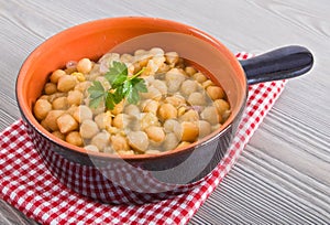 Chickpea soup in terracotta bowl.