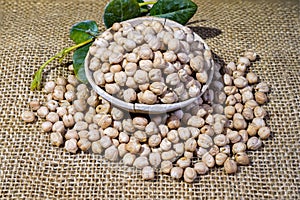 Chickpeas: composition of chickpeas with wooden container photo
