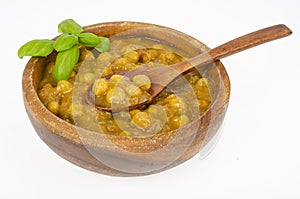 Chickpeas with curry sauce in wooden bowl. Studio Photo