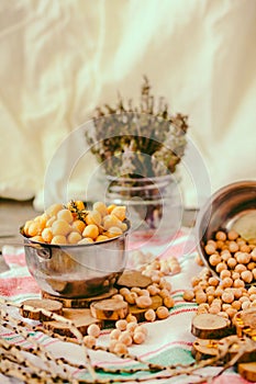 Chickpeas dry and boiled in an iron bowl, thyme. Rustik style background. Top view.