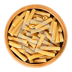 Chickpeas sedanini pasta in wooden bowl over white