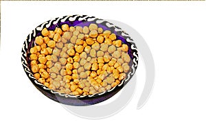 chickpeas or Turkish pea Cicer arietinum, in a round ceramic cup, top view. isolated