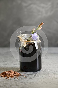 Chicory concentrate and flowers. Healthy herbal beverage, coffee substitute.