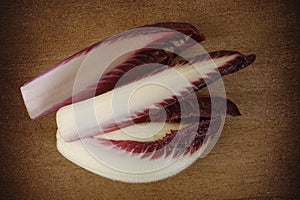 Chicory leaves on wooden background