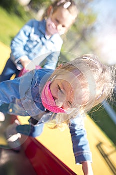 Chidren with a face mask on playground