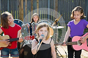 Chidren singer girl singing playing live band in backyard