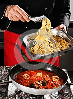 Chief add pasta in pan