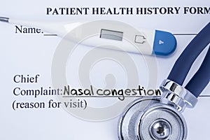 Chief complaint nasal congestion. Paper patient health history form, on which is written the complaint nasal congestion as the mai