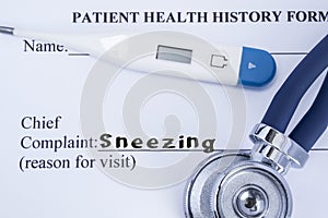 Chief complaint sneezing. Paper patient health history form, on which is written the complaint sneezing as the main reason for vis