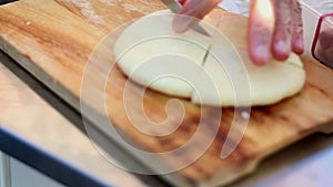 Chief cook slicing the pita - arabian bread