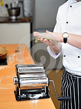 Chief creation of spaghetti with special machine