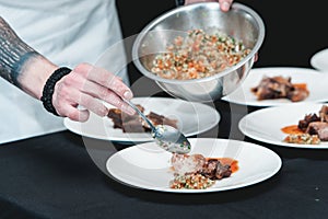 Chief serving homemade bone-in prime rib roast on a white plate