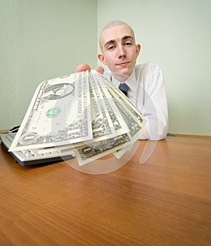 Chief stretching to us a pack of dollars