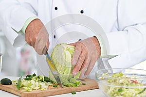 Chiefs hands cutting cabbage