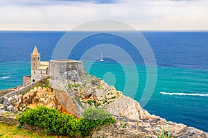 Chiesa San Pietro catholic church, Lord Byron Parque Natural park De Portovenere town on stone cliff rock, yachts on turquoise wat photo