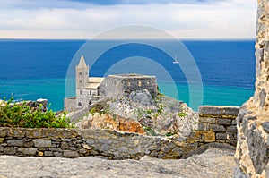 Chiesa San Pietro church, Lord Byron Parque Natural park De Portovenere town on stone cliff rock and blue sky, view from Doria cas photo