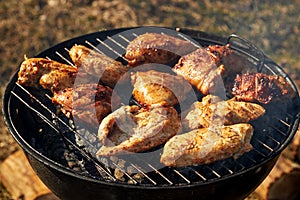 Chiken barbeque on a grill roasting open fire