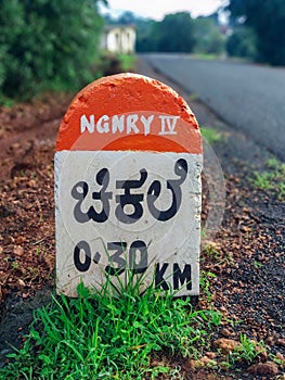 Milestone on a rural road at Chikhale village near Belgaum Karnataka