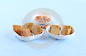 Chikki Indian Sweet Dish and its Main Ingredient Peanuts photo