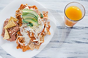 Chilaquiles rojos with chicken and avocado mexican food mexico breakfast