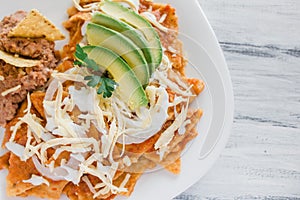 Chilaquiles rojos with chicken and avocado mexican food mexico breakfast photo